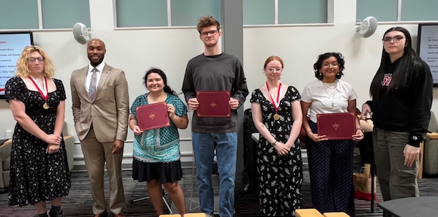 Hillyer College 2025 Young Alumnus Award-Winner Quoron J. Walker '14 (second from left) and some of the Hillyer College student award winners from left, Diana Isaacs, Victoria Carreras, Justin Wichowski, Jolene Tagnon, Arohi Verma, and Madeline Ketcham.